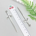 Detailed macro view of 10cm antique silver sword charms with Gladiator engraving detail - Antique Silver Sword (8076)