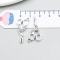 Detail of vintage silver scissor charms in alloy with intricate textured engravings - Antique Silver Crane Scissors Style (4342)