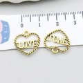 Close-up of heart-shaped antique gold alloy pendants with LOVE text and rope border - Antique Gold Heart Letter (17623)