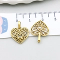 Detail view of 20mm antique gold hollow heart pendant with intricate filigree patterns - Antique Gold Heart (10255)