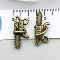 Bronze chainsaw pendants for DIY jewelry making with ruler showing 2.5cm size - Chainsaw (20438)