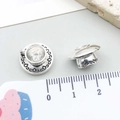 Macro detail of miniature silver teacup pendants showing 10mm scale and embossed texture - Antique Silver Coffee Tea Cup