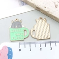 Detailed front and back view of cat in coffee cup enamel pendant with gold metal texture - Grey Enamel Tea Cup Cat