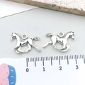 Detailed close-up of two silver horse pendants with ruler for 2.5cm size reference - Antique Silver Horse (2321) / 20*15mm