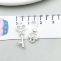 Detailed view of silver heart key charms with measuring tape showing 2.2cm size - Hollow Heart Key / 9*21mm (20957)