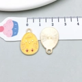 Detailed view of yellow enamel chick charm showing size comparison with measuring tape - Ginger Yellow Chick Egg (15139) / 14*22mm