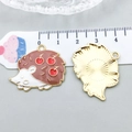 Brown enamel hedgehog pendant with cherry motif and golden metal back shown with ruler - Brown Enamel Hedgehog (20290)