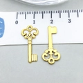 Antique gold finish heart-shaped hollow key pendant with a measurement ruler on grey background - Antique Gold Key (20746)