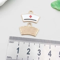Detailed front and back of 18mm enamel nurse hat charm with red cross on ruler - White Enamel Nurse Hat 20*14mm (12004)
