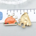 Front and back views of an orange turkey enamel alloy pendant for Thanksgiving jewelry - Orange Enamel Roast Turkey (20299)