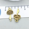 Antique gold owl-shaped key pendant charm measured with a ruler for DIY jewelry - Antique Gold Owl Key (20955)