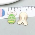 Green enamel Easter egg pendant with pink rabbit ears and Happy Easter text detail - Happy Easter Text Egg (18599) / 17*22mm