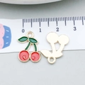 Detail of red cherry charms with green leaves showing front enamel and gold metal back - Cherry (8621) / 1 Piece (12*18mm) / Red