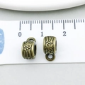 Macro view of 10mm antique bronze alloy spacer beads with ethnic totem for DIY jewelry - Antique Bronze Totem Charm (20664)