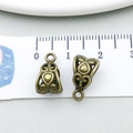 Macro shot of vintage bronze alloy bail pendant connector with ornate carved patterns - Antique Bronze Filigree (20666)