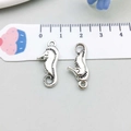 Macro shot of vintage silver seahorse charms with precise measurement on ruler - Antique Silver Seahorse Style (9193) / 10*22mm