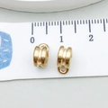 Macro detail of gold-plated alloy jewelry connectors showing dimensions on a scale - Glossy Double Ring Style (11631)