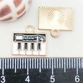Macro shot of 25mm black and white enamel piano keyboard pendant with size scale - Black and White Enamel Piano (13*15mm)
