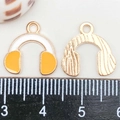 Macro detail of a 20mm golden headphone charm with white and yellow enamel inlay - Yellow Enamel Headphones (15*15mm)