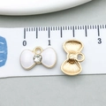 Golden butterfly pendant with white enamel and rhinestone for DIY jewelry making - Bowknot Shape
