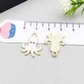 White enamel octopus DIY charms with golden edges on a scale board for jewelry making - Octopus / White