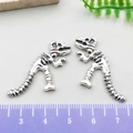 Macro di ciondoli a forma di scheletro di dinosauro argento con scala di misura - Drago Scheletro in Argento Antico (18580)
