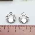 Detailed view of antique silver heart wing charms on a ruler showing 2.3cm scale - Antique Silver Heart Wing (10054)
