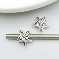 Detailed view of silver alloy star charms with granular texture for DIY jewelry making - 13*14mm / Antique Silver Starfish Large Hole Bead (6659)