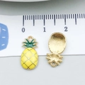 Golden pineapple charm pendant with yellow enamel inlay and green leafy top detail - Pineapple (21363)