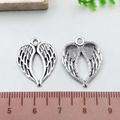Antique silver heart wings charms in heart shape showing size scale for DIY jewelry - Antique Silver Heart Wing (14097)