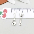 Detailed size view of a 2.5cm mini wrench charm in antique silver for DIY jewelry crafts - 7*24mm / Wrench (5274)