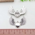 Antique silver wing heart pendant in alloy shown with measurement scale for size reference - Antique Silver Heart Wing (B220)