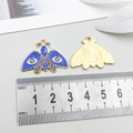 Detail view of moth enamel pendant dimensions with ruler showing 30mm width - Blue Butterfly (18695)
