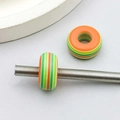 Macro detail of striped resin beads for DIY jewelry making on a metal thread rod - Orange Green Striped Big Hole Bead (13222) / 1 Piece/Pack (8*14mm)