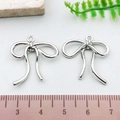 Silver bow knot alloy charm pendant for DIY jewelry with size scale reference - Small Bowknot (21383)