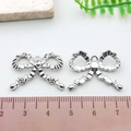Silver bow alloy pendant for DIY bracelets with polished finish and size scale - Pleated Bowknot (21391)