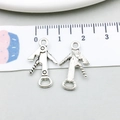 Macro view of silver wine opener charms showing front and back details for jewelry DIY - Antique Silver Opener / 12x21mm