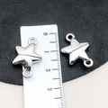 Set of two silver star magnetic jewelry clasps for DIY bracelet making shown with a ruler - Silver Star Shape Style (19852) / 21*15mm