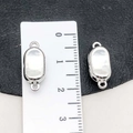 Silver oval magnetic clasp for jewelry making on a black textured background - Silver Ingot Shape Style (19857) / 17*7mm