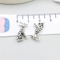 Detail of silver dalmatian dog charms with scale showing 2cm size for DIY jewelry - Antique Silver Puppy 13x17mm (3344)