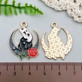 Macro shot of Ghostface moon pendant showing enamel front and textured gold back - Black Enamel Moon Raven Ghost Rose (21745)