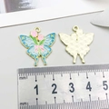 Pendentif papillon émail bleu avec fleurs roses et dos doré pour la création de bijoux - Papillon Tulipe Bleu Lac (18108)