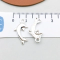 Macro shot of silver dolphin pendants with measurements showing front and back detail - Bright Silver Dolphin (20685)