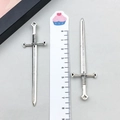 Detailed view of vintage silver sword pendants with ruler showing 8.2cm length - 7x44mm / Antique Silver (8074)