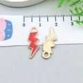 Macro view of colorful lightning bolt pendant with red enamel finish and size scale - Red (12443)