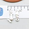 Polished silver mermaid charms for DIY bracelets and necklaces shown with a ruler - Bright Silver Mermaid (20702)