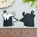 Detailed front and back views of black and white enamel cat on book alloy pendants - 26*25mm / Cat On Books