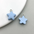 Detail of light blue matte resin star charms with silver rings for DIY jewelry making - Lake Blue