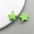 Detail of two light green frosted resin star pendants with silver rings for DIY jewelry - Grass Green