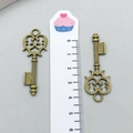 Detailed view of two vintage bronze alloy key charms measuring approximately 4.5 cm each - 17*48mm Style (51)